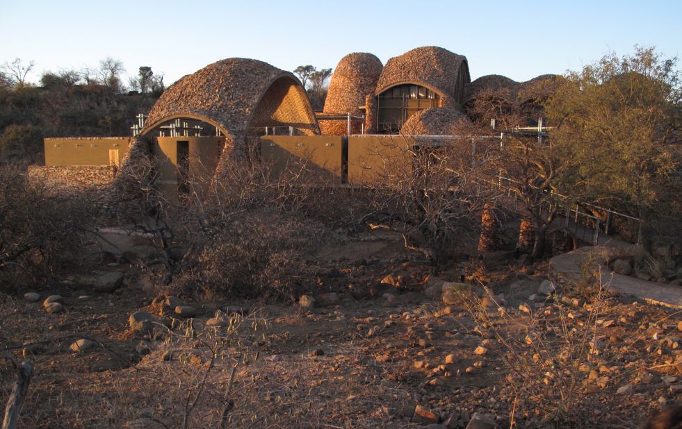 Mapungubwe Interpretation Centre is a cultural building designed to host ancient South African artifacts. Described as a "poverty relief project using ecological methods and materials" the architects sourced local materials (such as local pressed soil cement tiles) for building and turned to local labor forces for construction in an effort to help the community. 