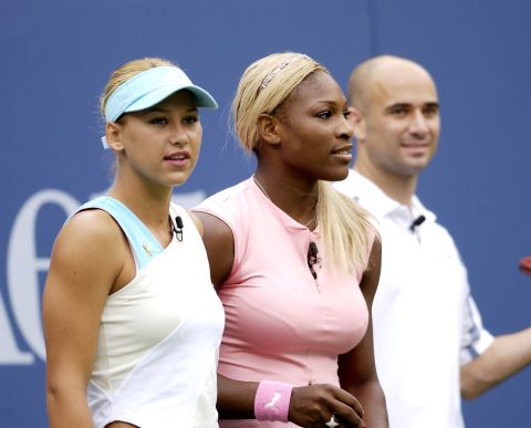 Here, she appears alongside tennis greats Serena Williams and Andre Agassi during a children's tennis event in New York.  