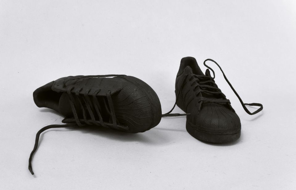 In the corner, a pair of trainers are unexpectedly cast in bronze. Surprising materials were key, says Ingar Dragset: "I like it, myself, when I see artwork dealing with a specific material and whenever you see that material again you think about it differently, or you relate to it differently."