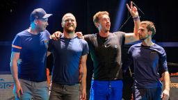 (L-R) Guitarist Jonny Buckland, drummer Will Champion, frontman Chris Martin and bassist Guy Berryman of Coldplay take a bow after performing onstage at the 2015 iHeartRadio Music Festival at MGM Grand Garden Arena on September 18, 2015 in Las Vegas, Nevada. (Photo by Christopher Polk/Getty Images for iHeartMedia)
