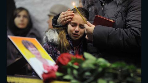A girl cries during a funeral this month for Nina Lushchenko, 60, a victim of the Metrojet crash.