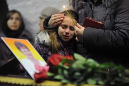 A girl cries during a funeral this month for Nina Lushchenko, 60, a victim of the Metrojet crash.