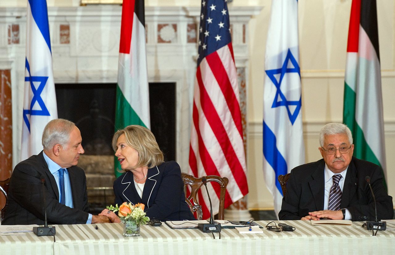 Clinton speaks with Netanyahu alongside Abbas as she hosts peace negotiations at the U.S. State Department on September 2, 2010.