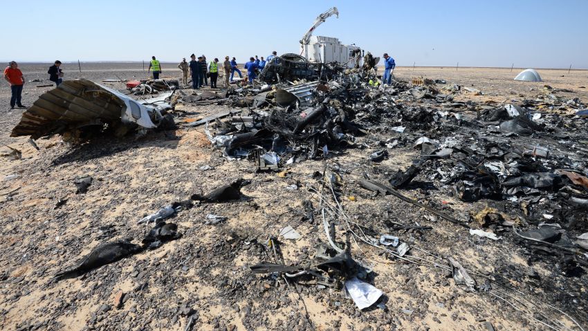In this Russian Emergency Situations Ministry photo, made available on Monday, Nov. 2, 2015 Russian and Egyptian experts work at the crash site of a Russian passenger plane bound for St. Petersburg in Russia that crashed in Hassana, Egypt's Sinai Peninsula, on Monday, Nov. 2, 2015. A Russian cargo plane on Monday brought the first bodies of Russian victims home to St. Petersburg, from Egypt.(Russian Ministry for Emergency Situations photo via AP)