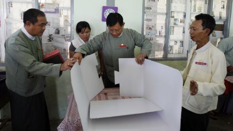 Tin Aye, chairman of Myanmar's Union Election Commission, inspects a polling station in Naypyidaw on November 7.