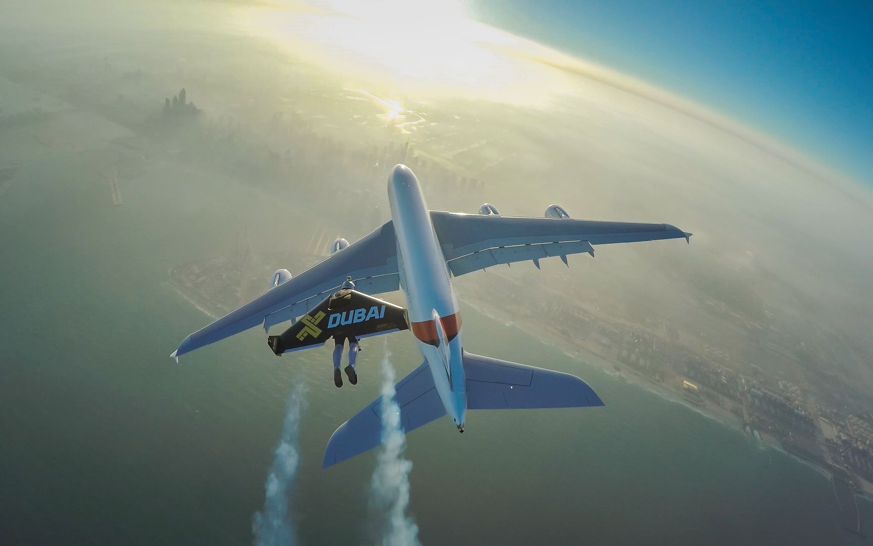 Watch Two Men in Jetpacks Fly Alongside a Jumbo Jet Over Dubai