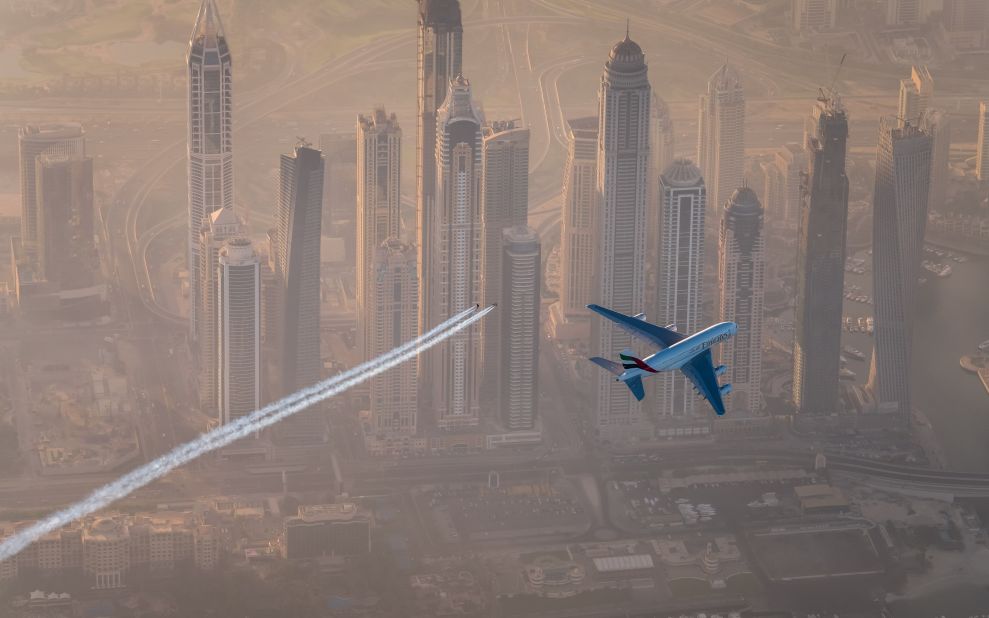 The breathtaking flight took 10 minutes with the A380 banking and turning, leading the two jet wing pilots through a series of maneuvers with the desert city's futuristic skyline shimmering in the background.