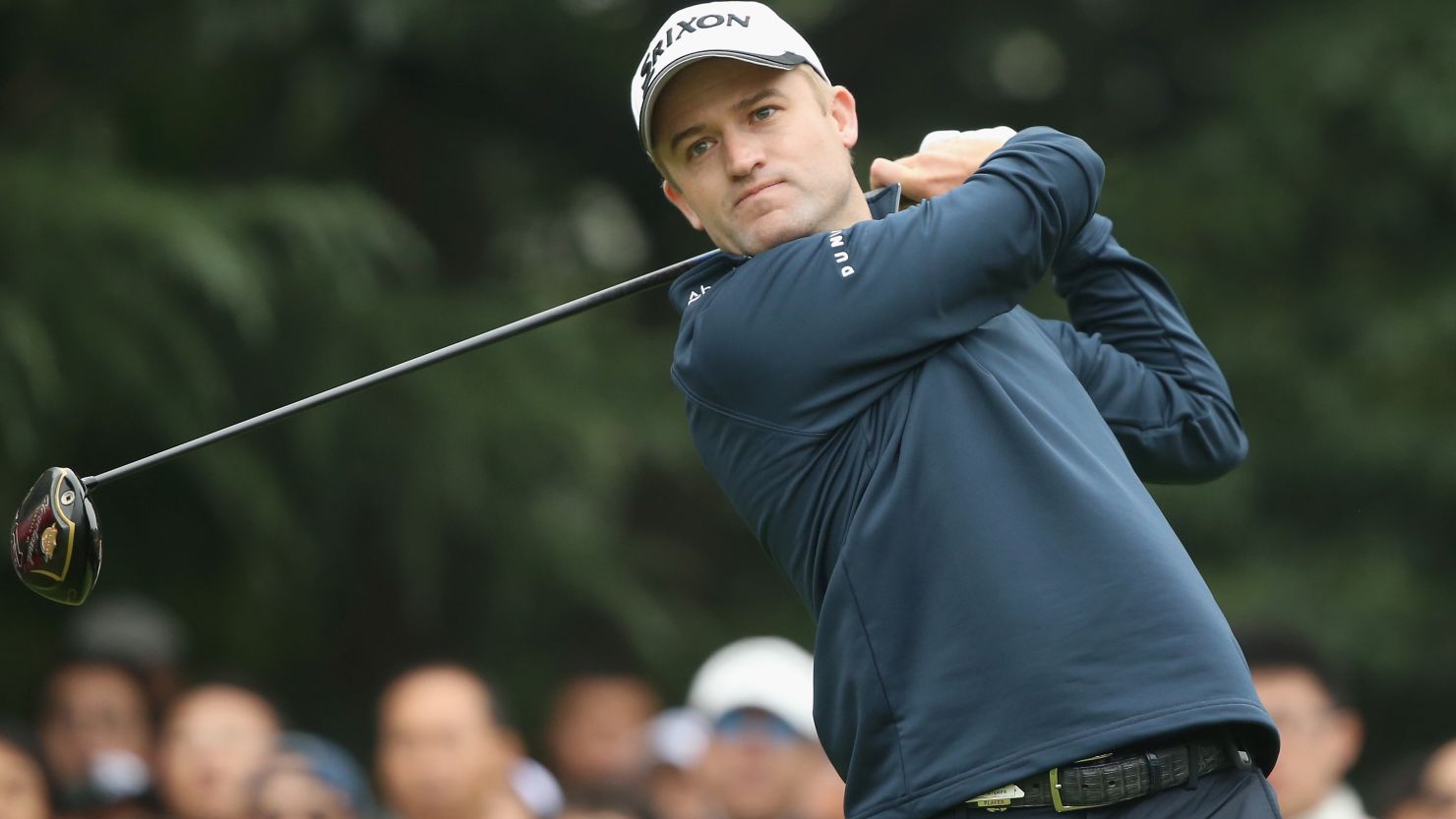 Russell Knox of Scotland showed steely determination to win his first major tournament with a closing 68 in China.