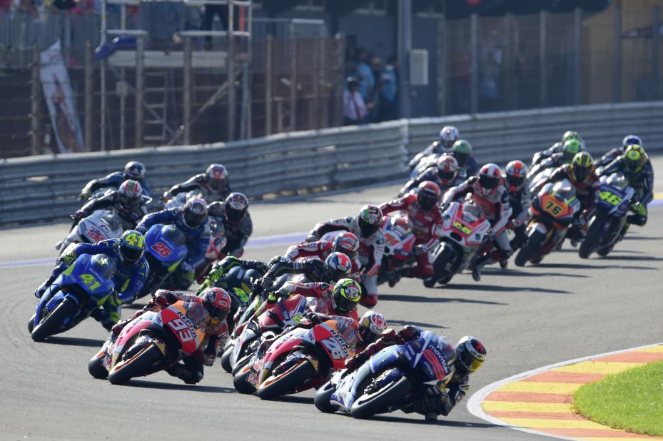 Lorenzo leads away from the start of the Valencia Grand Prix after taking first place on the grid. Rossi (no 46) can be seen towards the rear of the field.