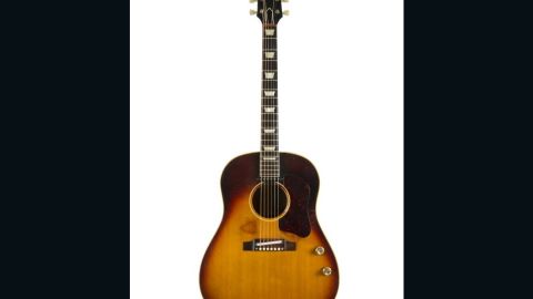 A 1962 Gibson J-160E acoustic guitar owned by John Lennon has sold for $2.4 million at auction.