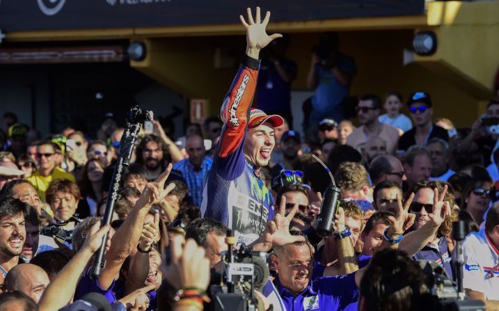 Lorenzo celebrated his win before a capacity 110,000 crowd at the Ricardo Tormo racetrack in Cheste, near Valencia. He had started the race seven points behind Rossi in the overall standings.