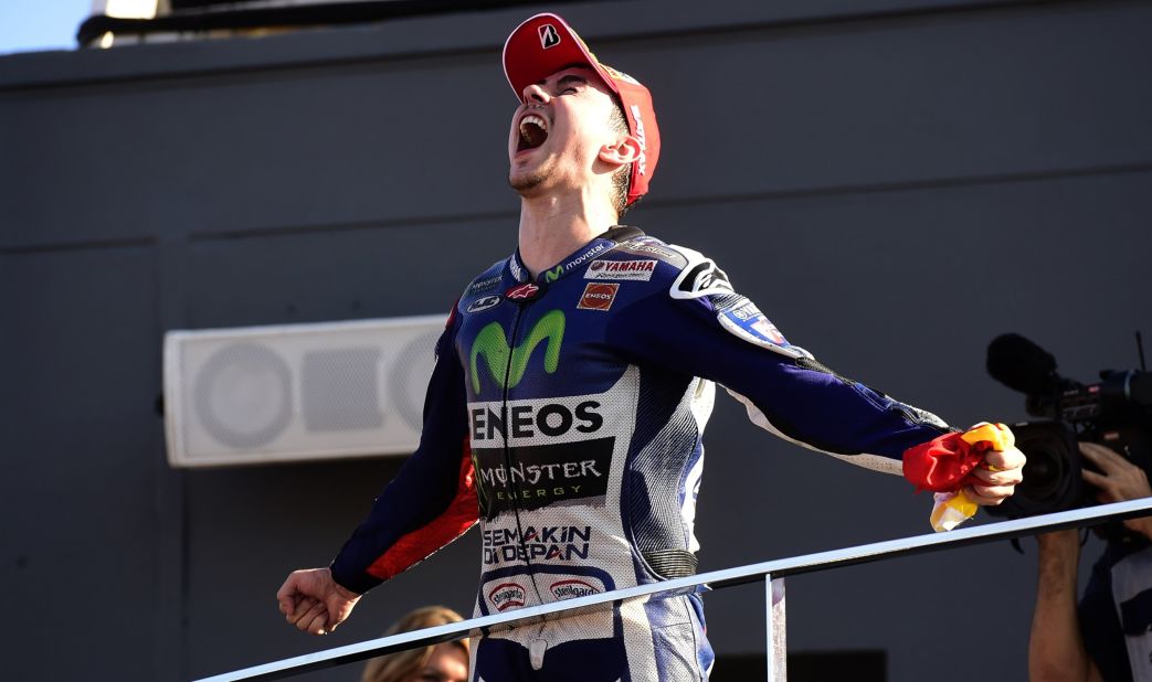 Movistar Yamaha's Jorge Lorenzo shows his sheer delight at clinching his third MotoGP title after winning the Valencia Grand Prix. He edged teammate Valentino Rossi by just five points in the overall standings.