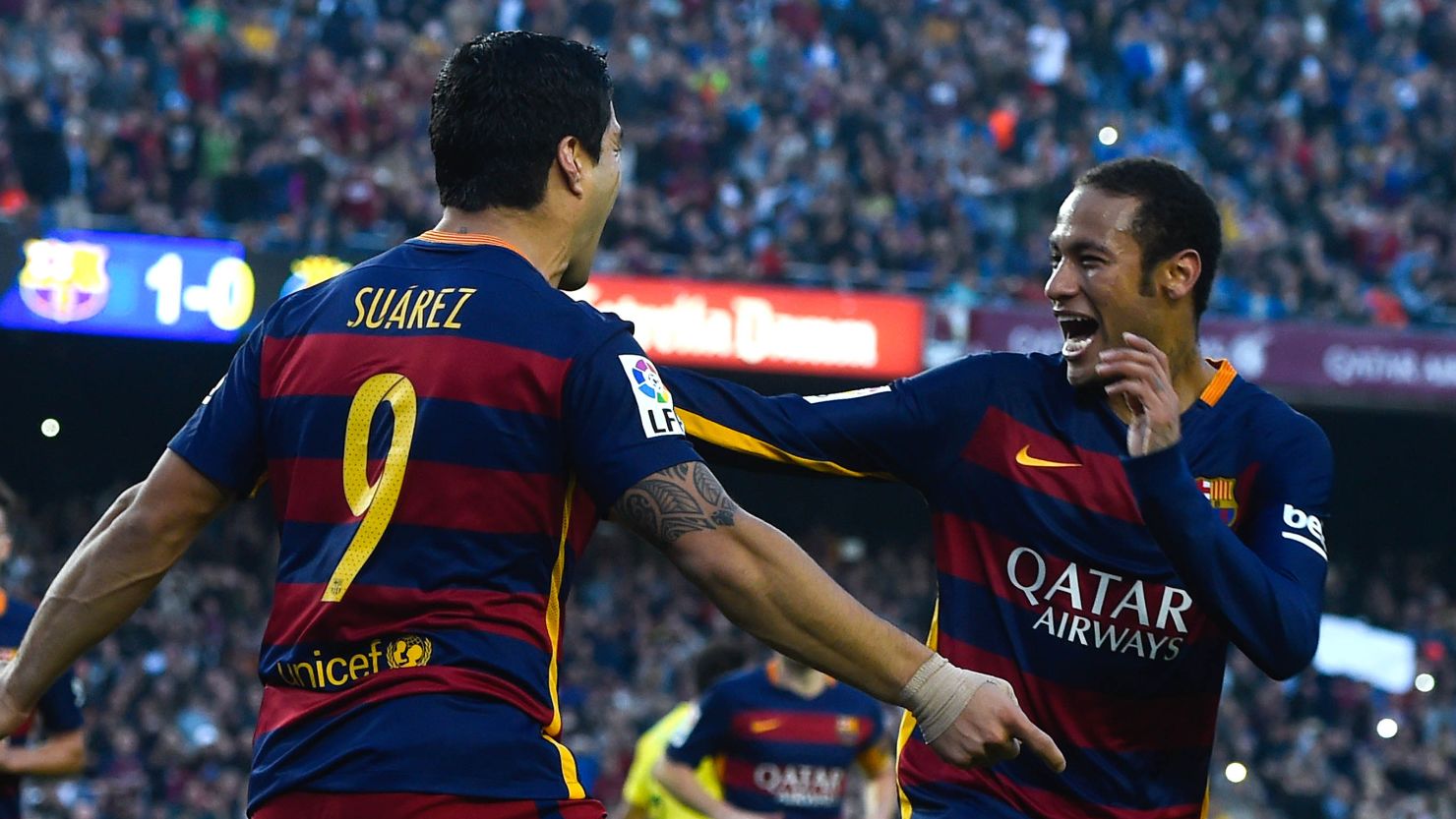 Luis Suarez celebrates with his teammate Neymar as the pair shared Barcelona's goals in the 3-0 win over Villarreal.