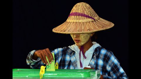 A woman casts her vote in a polling station in Naypyidaw, Myanmar, on Sunday, November 8. 