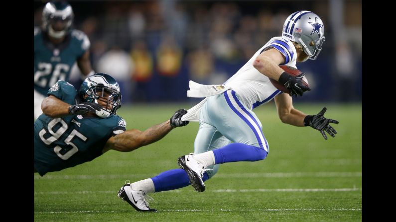 Philadelphia linebacker Mychal Kendricks holds onto Dallas' Cole Beasley during an NFL game in Arlington, Texas, on Sunday, November 8.