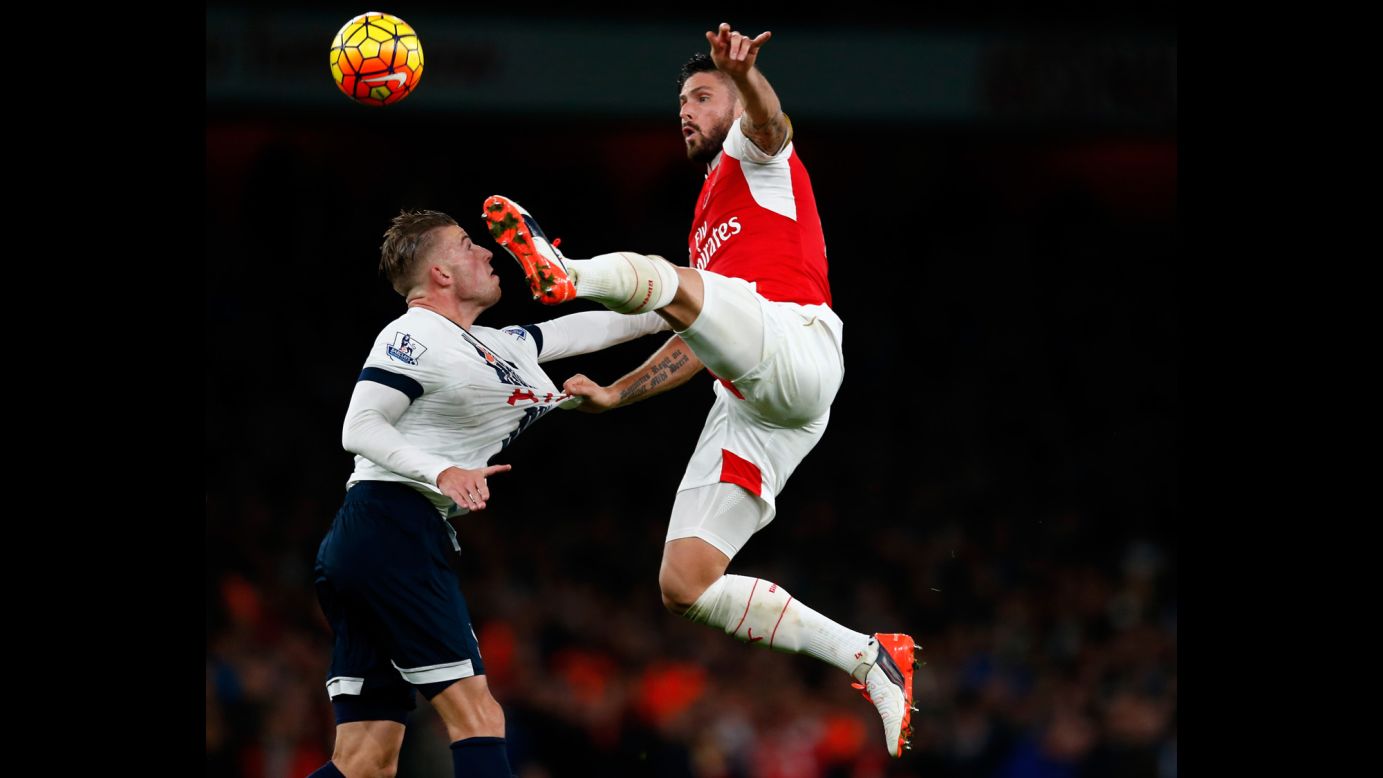 Arsenal's Olivier Giroud, right, competes with Tottenham's Toby Alderweireld during a Premier League match in London on Sunday, November 8. The rival clubs tied 1-1.