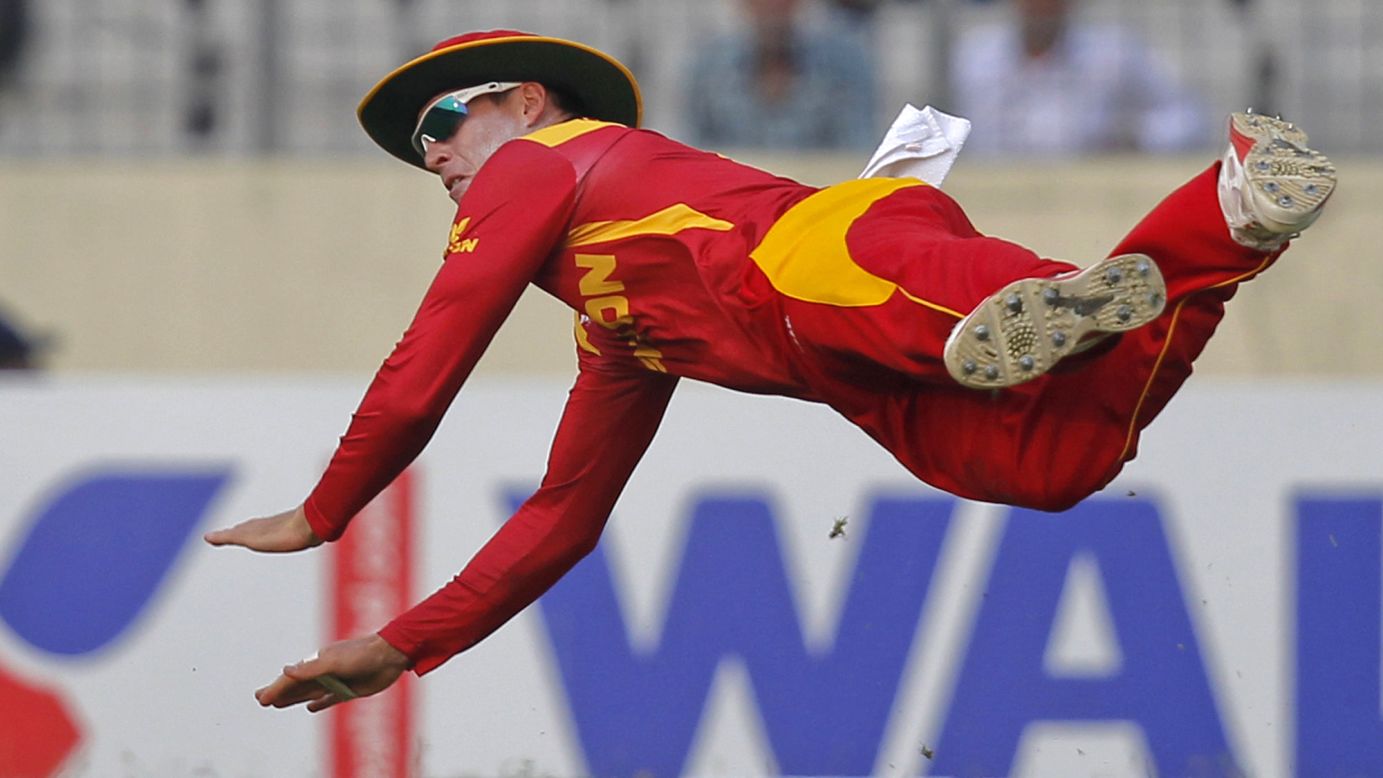 Zimbabwe's Craig Ervine dives to stop the ball during a cricket match in Dhaka, Bangladesh, on Monday, November 9.