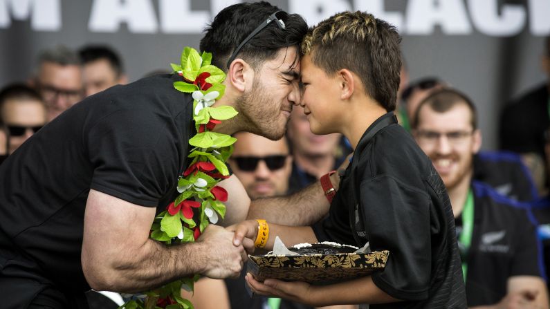 New Zealand rugby player Nehe Milner-Skudder rubs noses with young fan Kuratiwaka Ngarimu during a welcome-home parade for the national team on Wednesday, November 4. The "All Blacks" defended their Rugby World Cup title by defeating Australia in the tournament final.