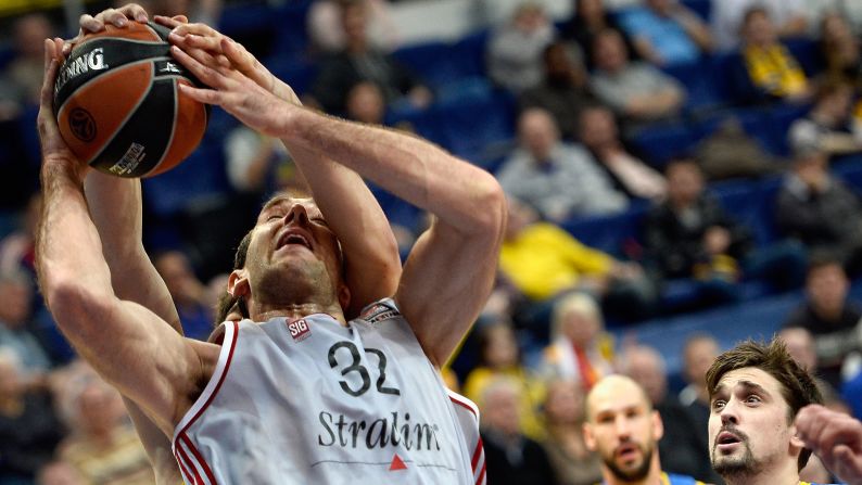 Strasbourg center Vladimir Golubovic is tied up by a defender from Khimki Moscow Region during a Euroleague game in Moscow on Thursday, November 5.