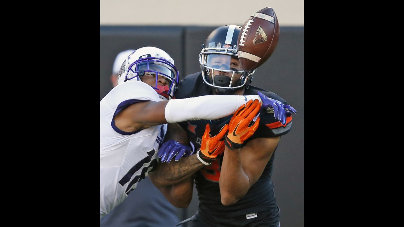 TCU safety Nick Orr, left, breaks up a pass intended for Oklahoma State wide receiver Marcell Ateman during a college football game in Stillwater, Oklahoma, on Saturday, November 7.