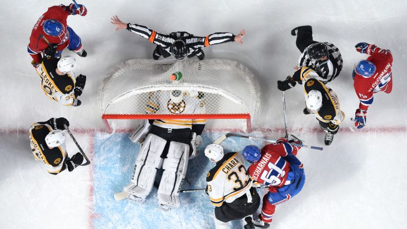 Boston goalie Jonas Gustavsson covers up the puck with his body during an NHL game in Montreal, Quebec, on Saturday, November 7.