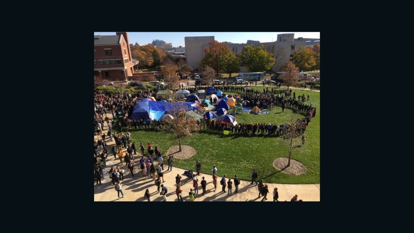 Missouri University students stood together in support of Tim Wolfe's resignation