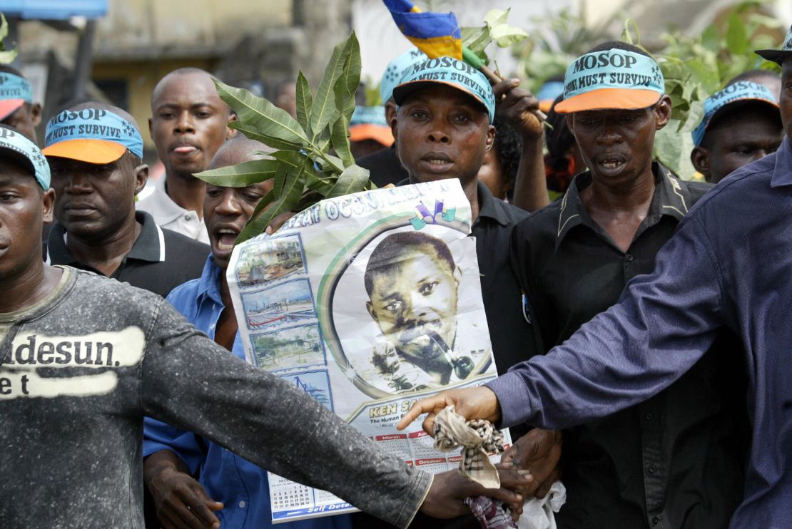 Ogoni indigenes carrying a poster of Ken Saro-Wiwa in a remembrance march in 2005.