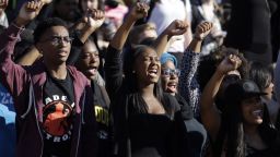 Students cheer while listening to members of the black student protest group Concerned Student 1950 speak following the announcement that University of Missouri System President Tim Wolfe would resign Monday, Nov. 9, 2015, at the university in Columbia, Mo. Wolfe resigned Monday with the football team and others on campus in open revolt over his handling of racial tensions at the school. (AP Photo/Jeff Roberson)
