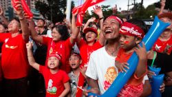 Supporters of Myanmar's National League for Democracy party cheer as election results are posted outside the NLD headquarters in Yangon, Myanmar, on Monday, November 9.