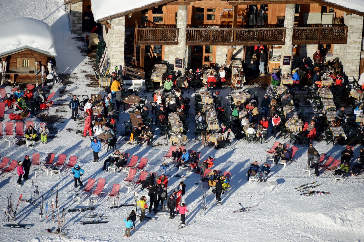 Skiers enjoy the winter sunshine at a restaurant in the French resort of Val d'Isere.