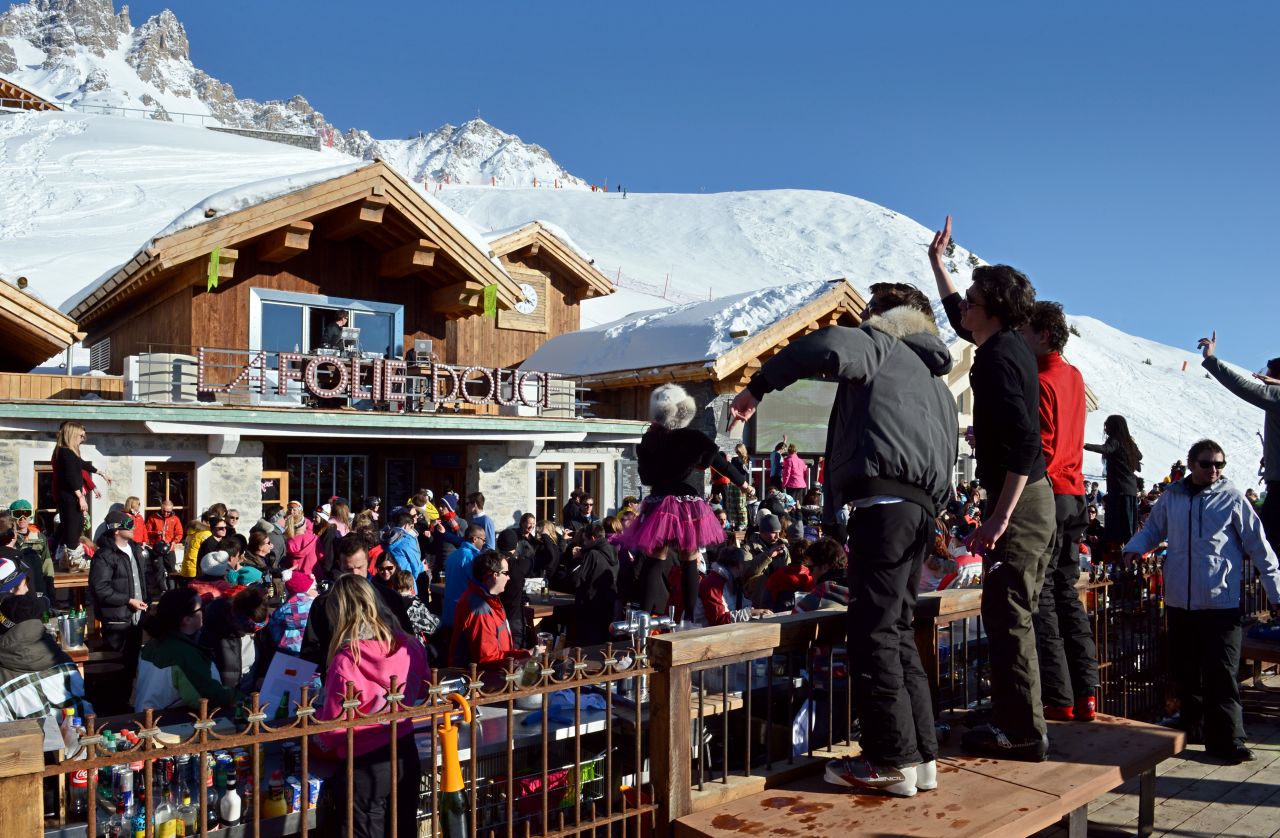 People party on an outdoor dance floor as artists perform during a food/clubbing event at <a href="http://www.lafoliedouce.com/en/folie-douce-spots/meribel-courchevel-en.html" target="_blank" target="_blank">La Folie Douce</a> in Meribel, France. La Folie's Fruitiere restaurant is where chef Franck Mischler creates a range of signature dishes.