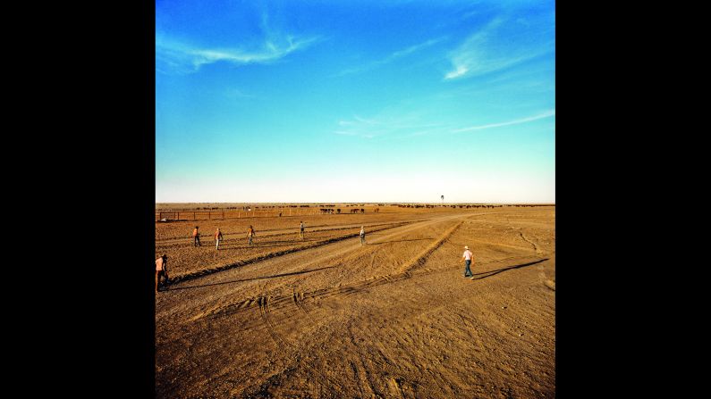 "I guess I saw a bit of myself in them. I had left my rat race searching for, well, something else. I strongly felt that one day I just had to go back devoting<br />time and effort to portray these men and women," Ludwigson wrote. Here, farm hands go to work in Rockhampton Downs, Northern Territory.