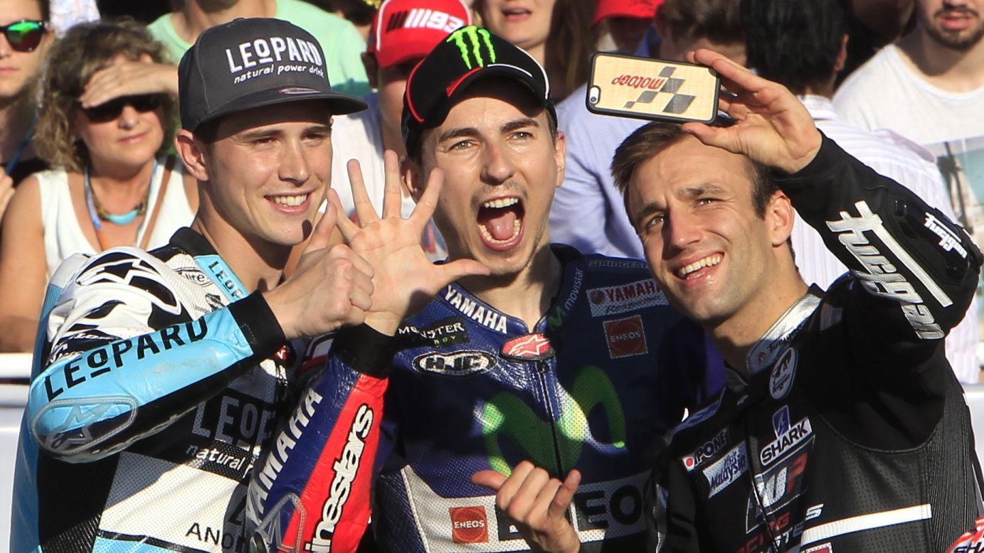 This year's motorcycle racing champions take a selfie together Sunday, November 8, at the end of the Valencia Grand Prix in Cheste, Spain. From right to left are Moto2 champion Johann Zarco, MotoGP champion Jorge Lorenzo and Moto3 champion Danny Kent. MotoGP is the highest of the three levels.