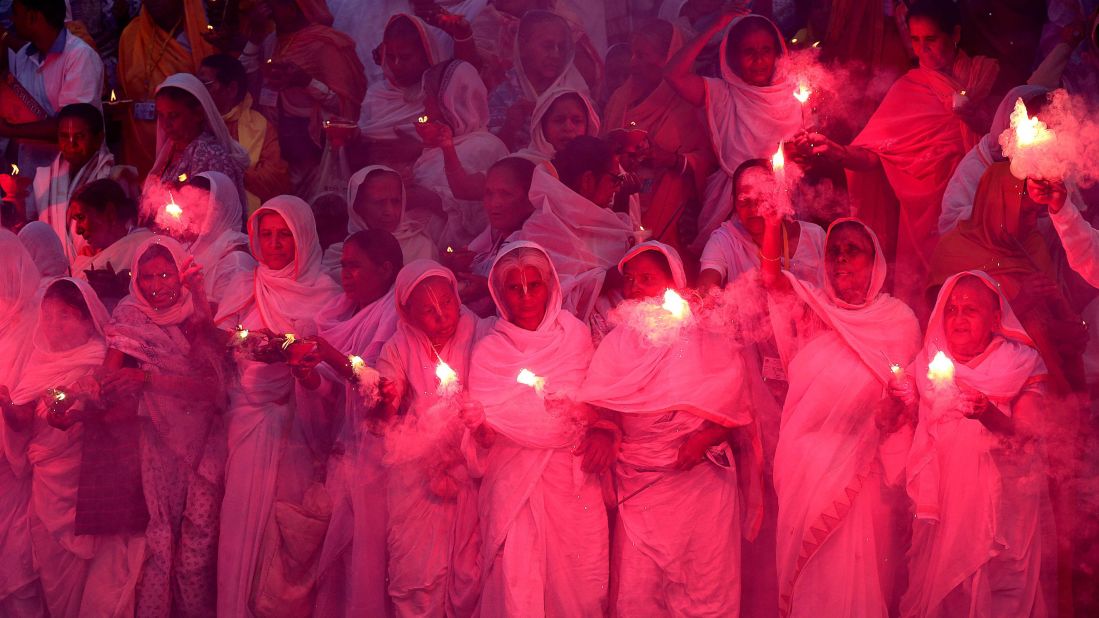 Hindu widows in Vrindavan, India, burn firecrackers on the eve of Diwali on Tuesday, November 10.