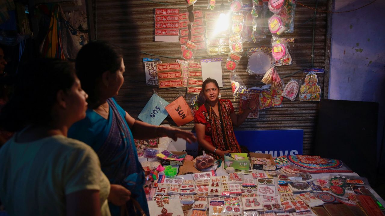 Women shop at a roadside stall in Mumbai on November 10.