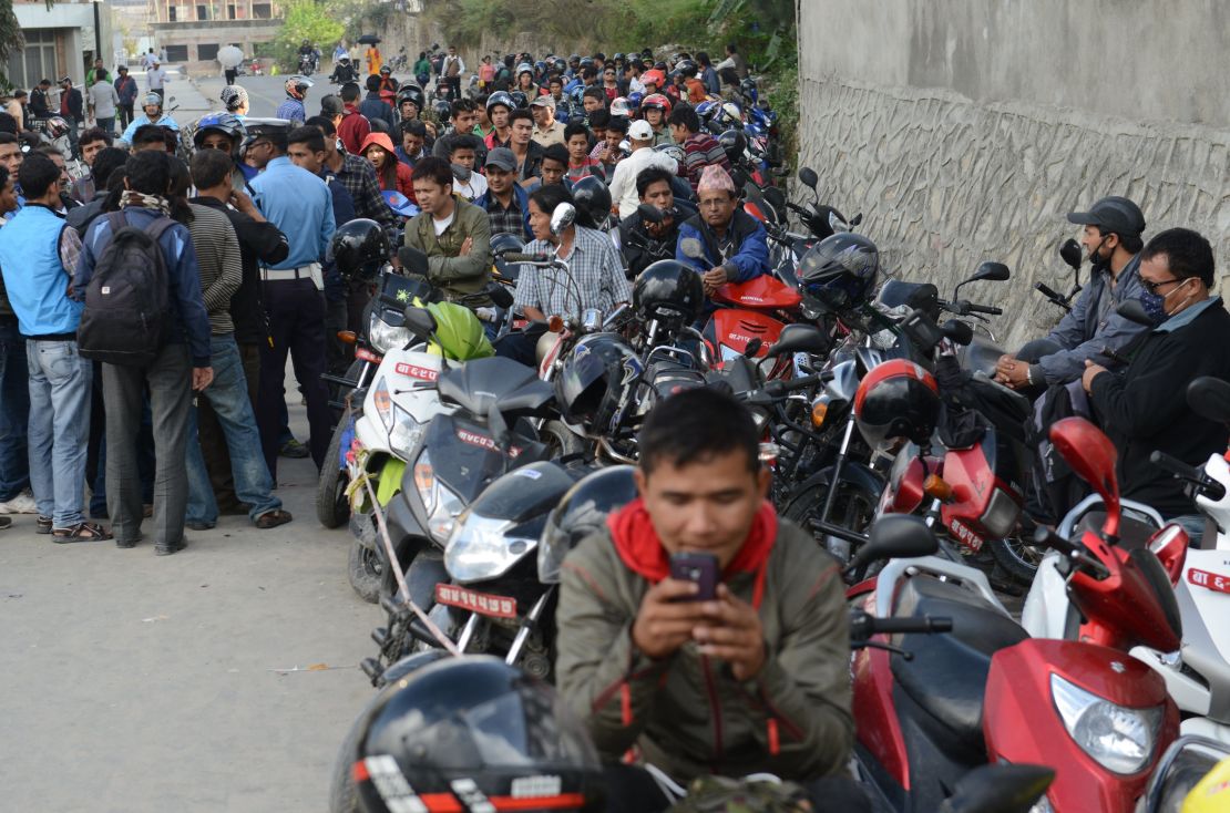 Long queues form as motorists wait for fuel, which has been rationed in Nepal, on October 15, 2015.