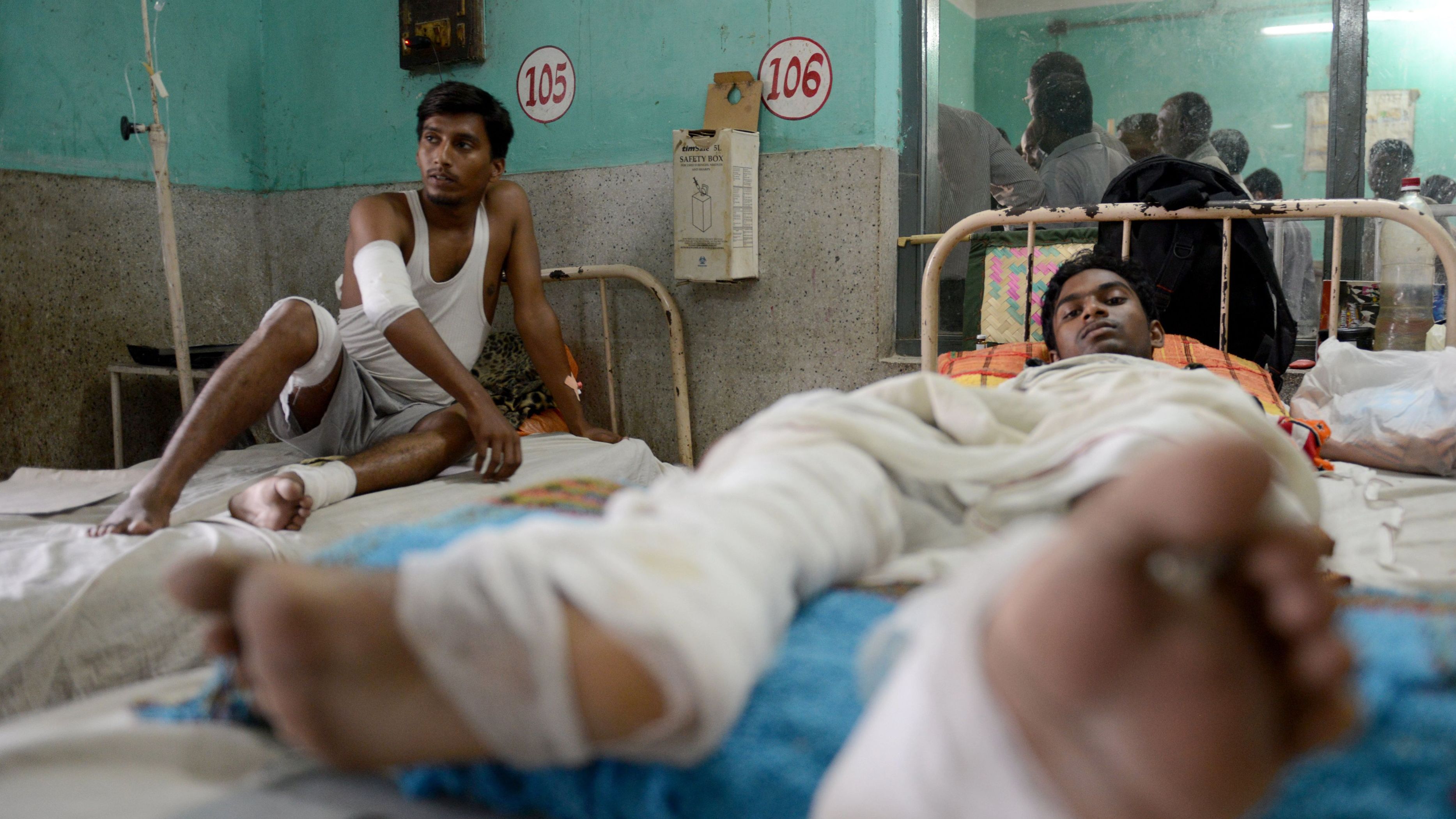 Nepalese activists receive medical treatment at a hospital near the Nepal-India border on November 4, 2015.