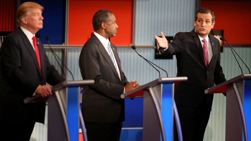 Republican presidential candidate Donald Trump (L) and Ben Carson (C) looks on as U.S. Sen. Ted Cruz (R-TX) speaks during the Republican Presidential Debate sponsored by Fox Business and the Wall Street Journal at the Milwaukee Theatre on November 10, 2015 in Milwaukee, Wisconsin.