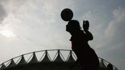 WUHAN, HUBEI - SEPTEMBER 22:  A Chinese girl goes up for a header before  the quarter final match of FIFA Women's World Cup China 2007 at Wuhan Sports Center Stadium on September 22, 2007 in Wuhan, China.  (Photo by Feng Li/Getty Images)