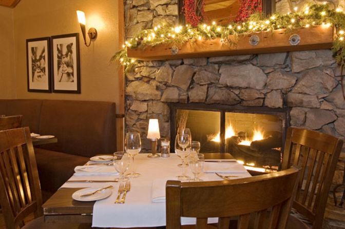 The cozy dining room of Whistler's <a href="index.php?page=&url=http%3A%2F%2Frimrockcafe.com%2F" target="_blank" target="_blank">Rimrock Cafe</a>, which was established in Canada's most famous ski resort in 1987 and specializes in local fish and game. 
