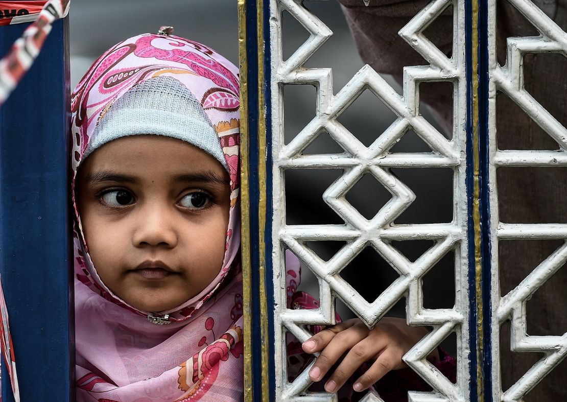 A Malaysian child watches Eid al-Adha celebrations at the Sultan Salahuddin Abdul Aziz mosque in Shah Alam.