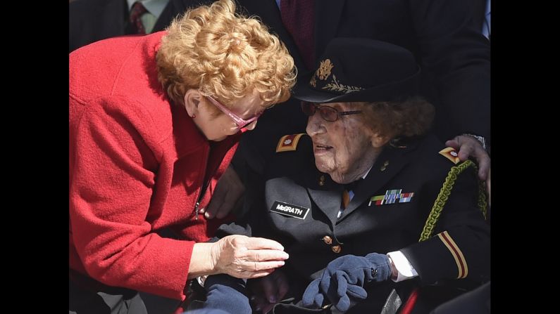 Army Lt. Col. Luta C. McGrath, who at 107 is the oldest known female World War II veteran, is greeted during a Veterans Day ceremony at Arlington National Cemetery in Arlington, Virginia.