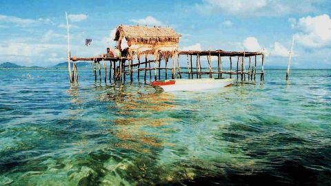   One of the many sea-huts is seen in the waters near Sipadan Island, 14 April 2001, in Malaysia's eastern Sabah state. The huts are inhabited by locals, many of whom have Filipino relatives, who harvest the abundance sea weed for a living. 