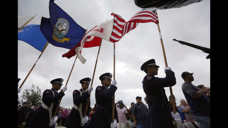A color guard presents the flags during a Veterans Day observance in San Antonio.