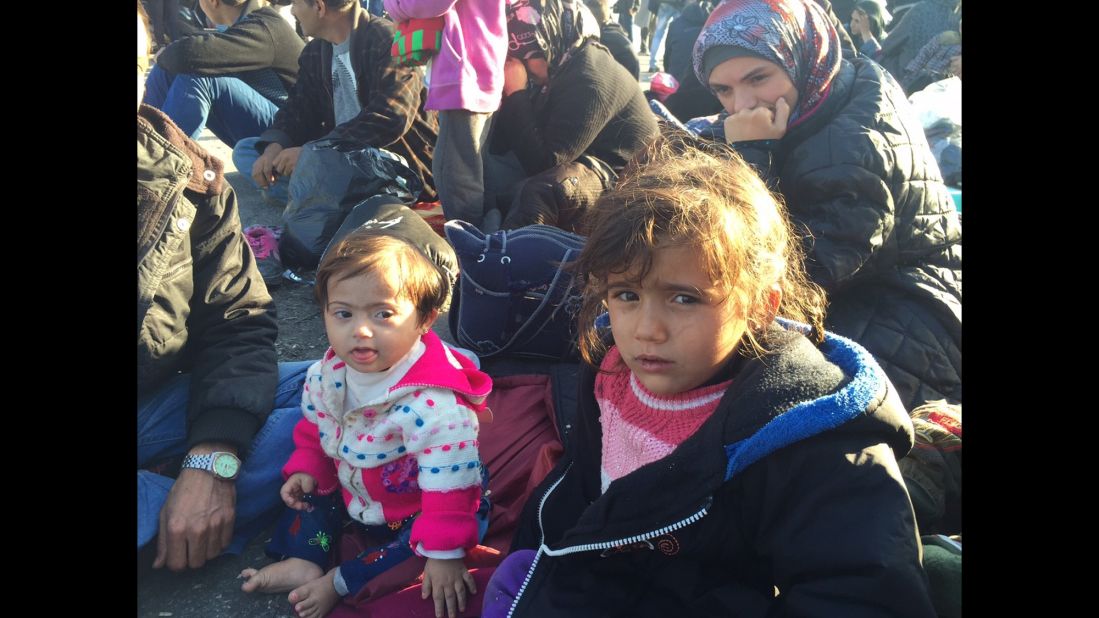 Emine and Wahibe, aged 2.5 and 4, respectively, are sisters from Aleppo, Syria. They are waiting with their parents for the boat to take them to Athens.