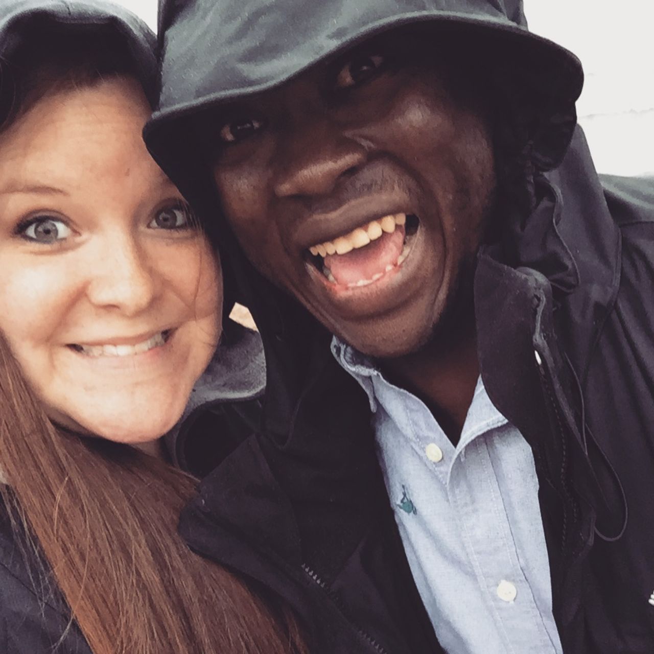 Kristin and Eric Njimegni take a selfie in the rain. The couple met in Moscow while studying and working abroad.