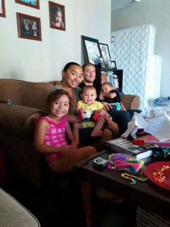 Daniel and Natalie Martinez-Vlasoff pose with their three children in their home in Los Angeles in 2014. The couple welcomed a fourth child in November.