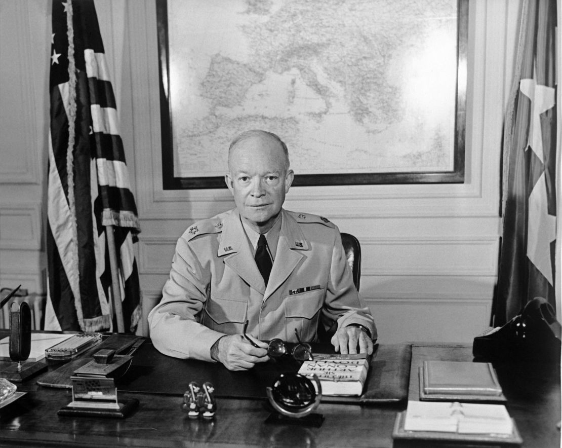 The former Commander in chief of the Allied forces in Europe (1943) and the future US President General Dwight David "Ike" Eisenhower (1890-1969) poses for a photographer in 1951 at NATO Paris headquarters.