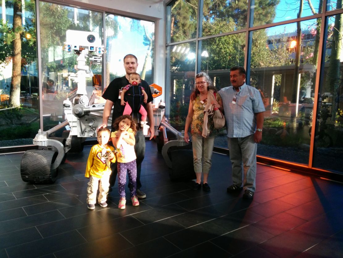 Natalie photographs the family and Daniel's parents taking a tour of NASA's Jet Propulsion Laboratory.