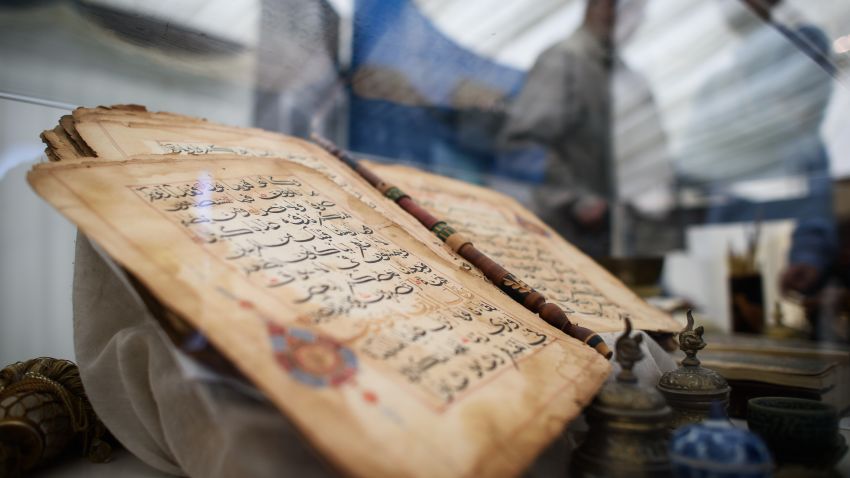 A 750 year old Koran is on show at an annual three-day event for members of the Ahmadiyya Muslim community known as the Jalsa Salana, in Hampshire on August 21, 2015. Over thirty thousand people are expected to attend, culminating in a pledge of allegiance to the Caliph on Sunday. Now in it's 49th year, Muslims from around 100 countries will attend the Jalsa Salana to listen to speeches by the Caliph. 
AFP PHOTO/Leon Neal        (Photo credit should read LEON NEAL/AFP/Getty Images)